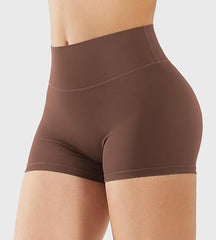 Brown high-waisted shorts on a white background