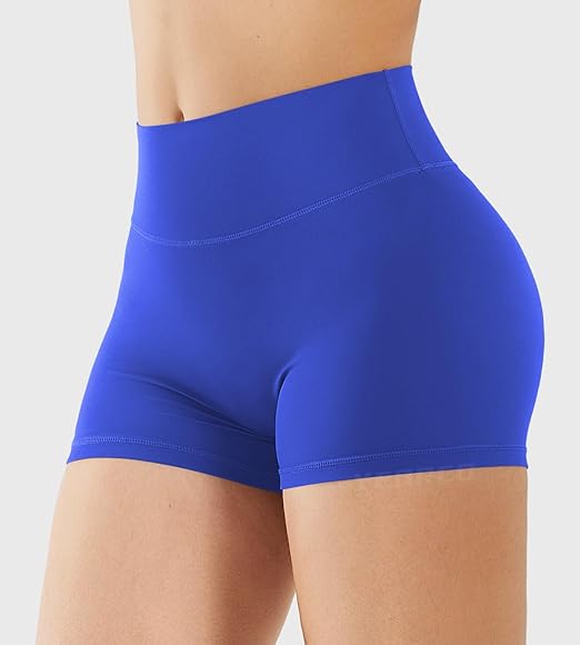 Blue athletic shorts worn by a person on a light gray background