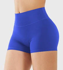 Blue athletic shorts worn by a person on a light gray background